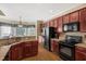 Bright kitchen displays granite countertops, a black appliance package and a sunny breakfast nook at 95 Live Oak Dr, Louisburg, NC 27549