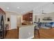 Charming kitchen boasts granite countertops, dark wood cabinetry, and breakfast bar seating at 95 Live Oak Dr, Louisburg, NC 27549
