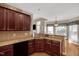 Eat-in kitchen features dark wood cabinetry, granite countertops and easy access to living areas at 95 Live Oak Dr, Louisburg, NC 27549