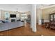 Open-concept living room with hardwood floors, fireplace, and seamless transition to dining area at 95 Live Oak Dr, Louisburg, NC 27549