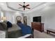 Spacious main bedroom features a large dresser, TV and stairway access at 95 Live Oak Dr, Louisburg, NC 27549
