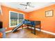 A bright bedroom with a bed and slide at 101 Rainbow Dr, Carrboro, NC 27510