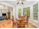Cozy breakfast nook featuring wood floors, large windows, and adjacent living area at 101 Rainbow Dr, Carrboro, NC 27510