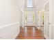 Inviting foyer with hardwood floors, leading to a bright entrance with transom windows at 101 Rainbow Dr, Carrboro, NC 27510