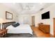 This is a primary bedroom that features a ceiling fan, natural light, and hardwood floors at 101 Rainbow Dr, Carrboro, NC 27510