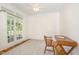 Bright office with wood floors, large windows, and desk at 101 Rainbow Dr, Carrboro, NC 27510