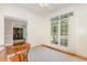 Bright office with wood floors, large windows, and desk at 101 Rainbow Dr, Carrboro, NC 27510