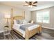 Bedroom with wooden four-poster bed and decorative pillows and blanket at 1015 E Maplewood, Benson, NC 27504