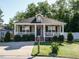 Charming single-story home featuring a inviting front porch, manicured lawn, and classic design elements at 1015 E Maplewood, Benson, NC 27504