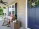 Inviting front porch with rocking chair and decorative wreath, creating a welcoming entrance at 1015 E Maplewood, Benson, NC 27504