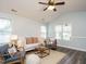Airy living room with large windows, comfortable seating, and a relaxing ambiance at 1015 E Maplewood, Benson, NC 27504