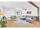 Cozy living room with hardwood floors, stylish sofa, and inviting natural light at 102 Lake Dr, Wendell, NC 27591
