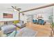 Open-concept living space with stylish seating and seamless flow to the dining area at 102 Lake Dr, Wendell, NC 27591