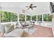 Screened-in porch with lots of seating and natural light at 102 Lake Dr, Wendell, NC 27591