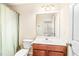 Functional bathroom featuring a shower-tub combo, neutral color scheme, and a vanity with ample storage space at 1028 Summerhouse Rd, Cary, NC 27519