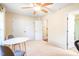 Bright and airy bedroom with a ceiling fan, large window, and neutral decor, perfect for relaxation and personalization at 1028 Summerhouse Rd, Cary, NC 27519