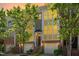 Inviting townhouse exterior with warm lighting, brick facade, and manicured landscaping at 1028 Summerhouse Rd, Cary, NC 27519