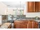 Spacious kitchen featuring granite countertops, stainless steel appliances, and modern fixtures at 1028 Summerhouse Rd, Cary, NC 27519