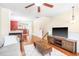 Bright living room features a cozy fireplace and gleaming hardwood floors at 1028 Summerhouse Rd, Cary, NC 27519