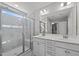 Bright bathroom featuring a large glass shower and double vanity with ample storage at 1042 Cardross St, Burlington, NC 27215