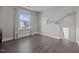 Spacious room with window views and dark wood flooring at 1042 Cardross St, Burlington, NC 27215