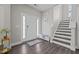 Inviting entryway features stylish flooring, a staircase, and plenty of natural light at 1042 Cardross St, Burlington, NC 27215