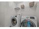 Modern laundry room equipped with front-loading washer and dryer units at 1042 Cardross St, Burlington, NC 27215