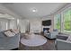 Comfortable living room featuring a fireplace, neutral decor, and lots of light at 1042 Cardross St, Burlington, NC 27215
