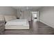 Large main bedroom with ceiling fan, plenty of natural light, and dark wood flooring at 1042 Cardross St, Burlington, NC 27215