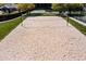An empty sand volleyball court, next to a tennis court and grassy lawn at 1042 Cardross St, Burlington, NC 27215