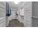 The walk-in closet boasts custom shelving and dark wood floors at 1042 Cardross St, Burlington, NC 27215