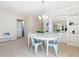 Charming dining area with a stylish chandelier and built-in shelving at 10436 Cokesbury Ln, Raleigh, NC 27614