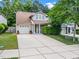 Charming home with a well-maintained front yard and a driveway leading to an attached garage at 10436 Cokesbury Ln, Raleigh, NC 27614
