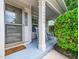 Inviting front porch with rocking chairs, a welcome mat, and tasteful landscaping at 10436 Cokesbury Ln, Raleigh, NC 27614