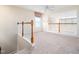 Open living area with staircase, featuring a ceiling fan and a view of an adjacent room at 10436 Cokesbury Ln, Raleigh, NC 27614