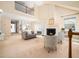 Open living room with fireplace, neutral decor, and views to the dining area at 10436 Cokesbury Ln, Raleigh, NC 27614
