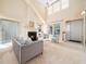 Bright living room featuring a fireplace, vaulted ceilings, and neutral decor at 10436 Cokesbury Ln, Raleigh, NC 27614