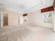 Spacious main bedroom with tray ceiling, neutral carpet, and windows that provide natural light at 10436 Cokesbury Ln, Raleigh, NC 27614
