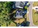Aerial view of a home featuring solar panels, fenced yard, and outdoor patio at 105 Blue Prince Trl, Holly Springs, NC 27540