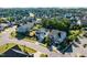 Aerial shot of a suburban neighborhood with homes, landscaped yards, mature trees, and a well-maintained community at 105 Blue Prince Trl, Holly Springs, NC 27540