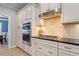 Updated kitchen with white cabinets, a gas stovetop, stainless steel appliances and subway tile backsplash at 105 Blue Prince Trl, Holly Springs, NC 27540