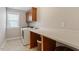 Laundry room with front load washer and dryer plus folding counter at 105 Blue Prince Trl, Holly Springs, NC 27540