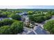 Stunning aerial neighborhood shot showing the clock tower and fountain surrounded by mature trees and beautifully landscaped homes at 10523 Bedfordtown Dr, Raleigh, NC 27614