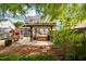 Expansive backyard with patio, pergola, hot tub, and mature trees at 10523 Bedfordtown Dr, Raleigh, NC 27614