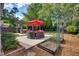 Lush backyard boasts a patio, hot tub, pergola and garden at 10523 Bedfordtown Dr, Raleigh, NC 27614