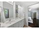 Bathroom features double sinks, modern faucets, and a view to the shower at 10523 Bedfordtown Dr, Raleigh, NC 27614