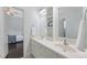 Bathroom features double sinks, modern faucets, and a bright view to the adjacent bedroom at 10523 Bedfordtown Dr, Raleigh, NC 27614
