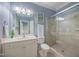Bathroom featuring a glass door shower and vanity with a sink at 10523 Bedfordtown Dr, Raleigh, NC 27614