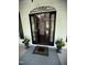 Inviting foyer showcasing an open doorway, a grand staircase, and elegant decor at 10523 Bedfordtown Dr, Raleigh, NC 27614