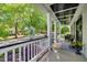 Inviting front porch featuring classic columns, ample seating, and a welcoming ambiance at 10523 Bedfordtown Dr, Raleigh, NC 27614